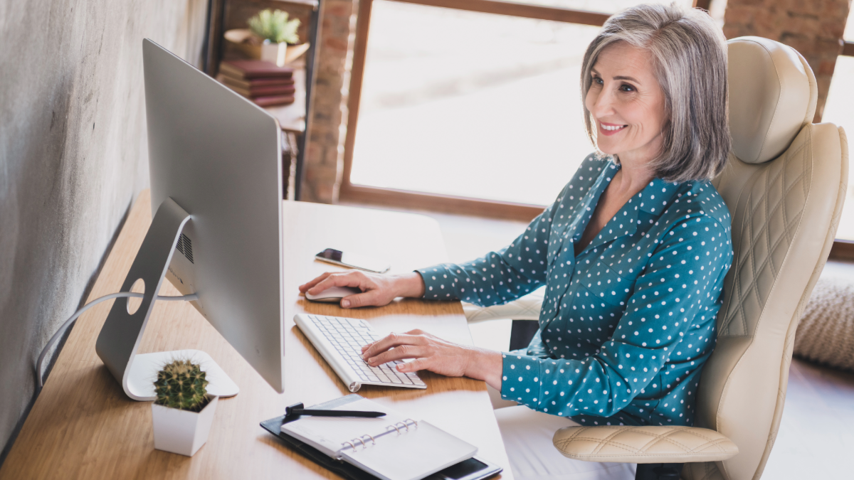 woman at computer in an ergonomic chair at home